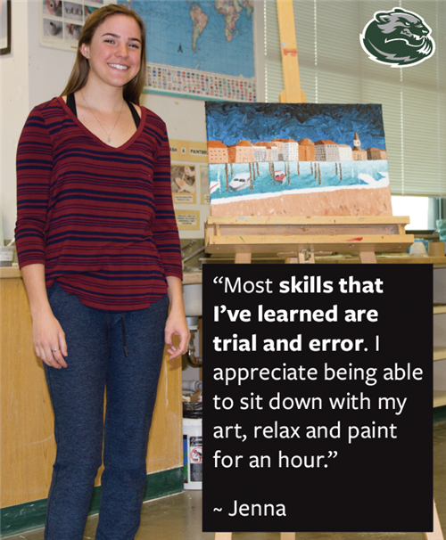 Wood River High School student standing next to her artwork 